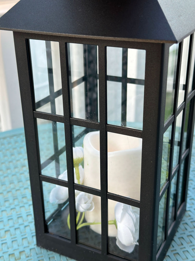 Solar Powered Black Lantern with Faux Candle and White Artificial Flowers
