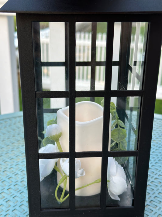 Solar Powered Black Lantern with Faux Candle and White Artificial Flowers