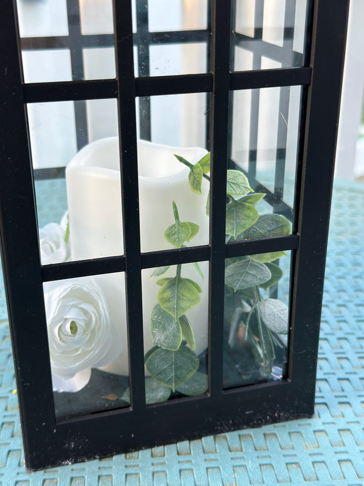 Solar Powered Black Lantern with Faux Candle and White Artificial Flowers