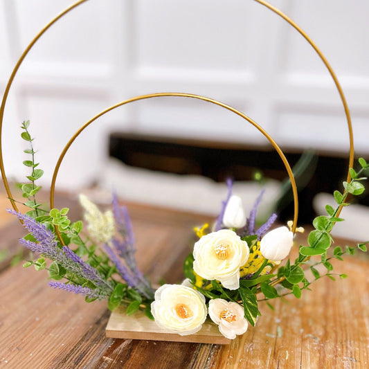 Double Golden Ring Tabletop Floral Arrangement.